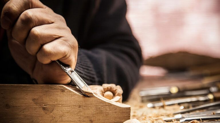 A closeup of a carpenter's hands at work