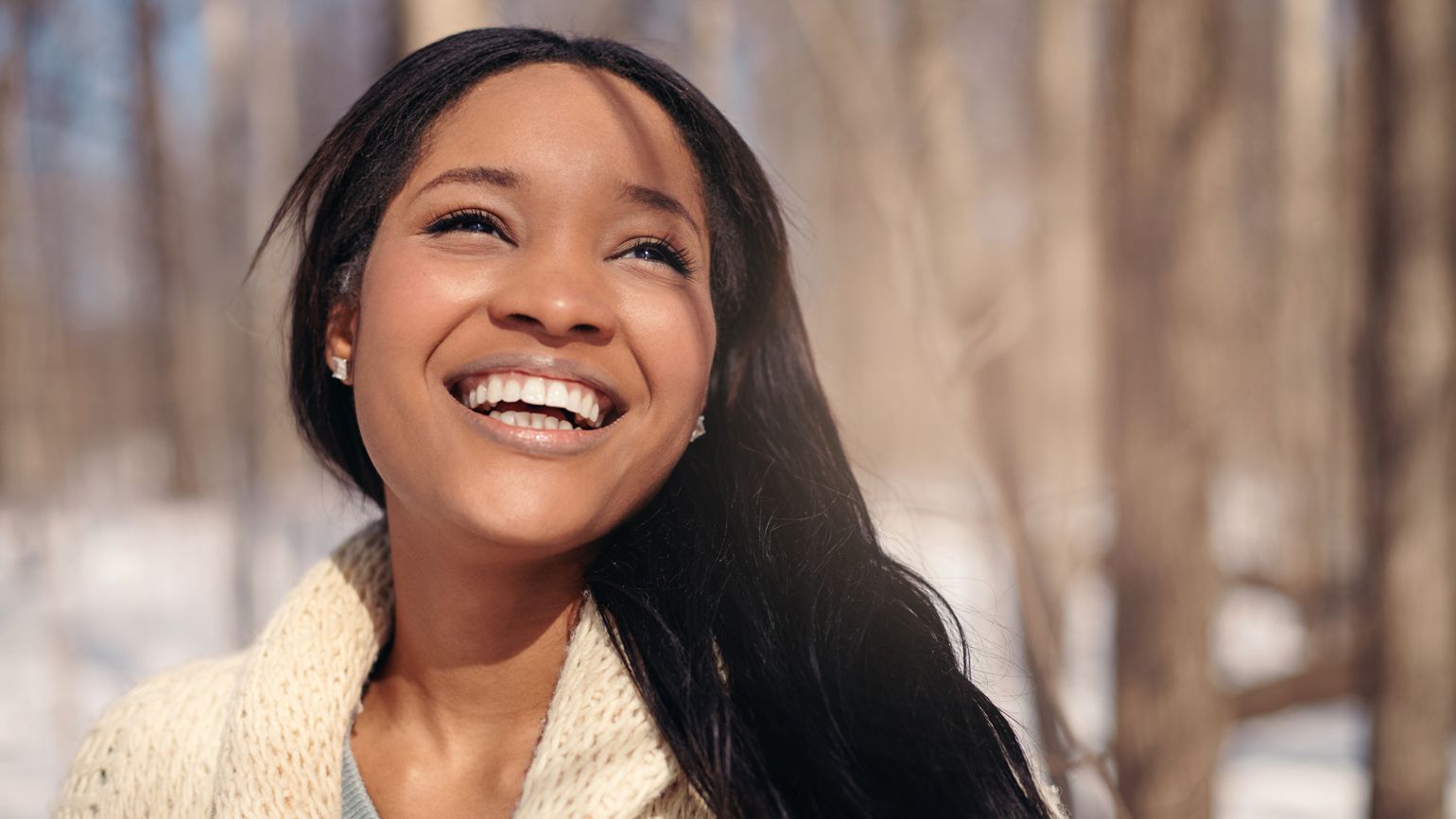 Health myths about Winter: Winter causes hair loss. Woman enjoying the winter outdoors. better living health wellness