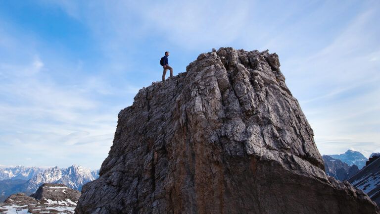 Man climbing cliff