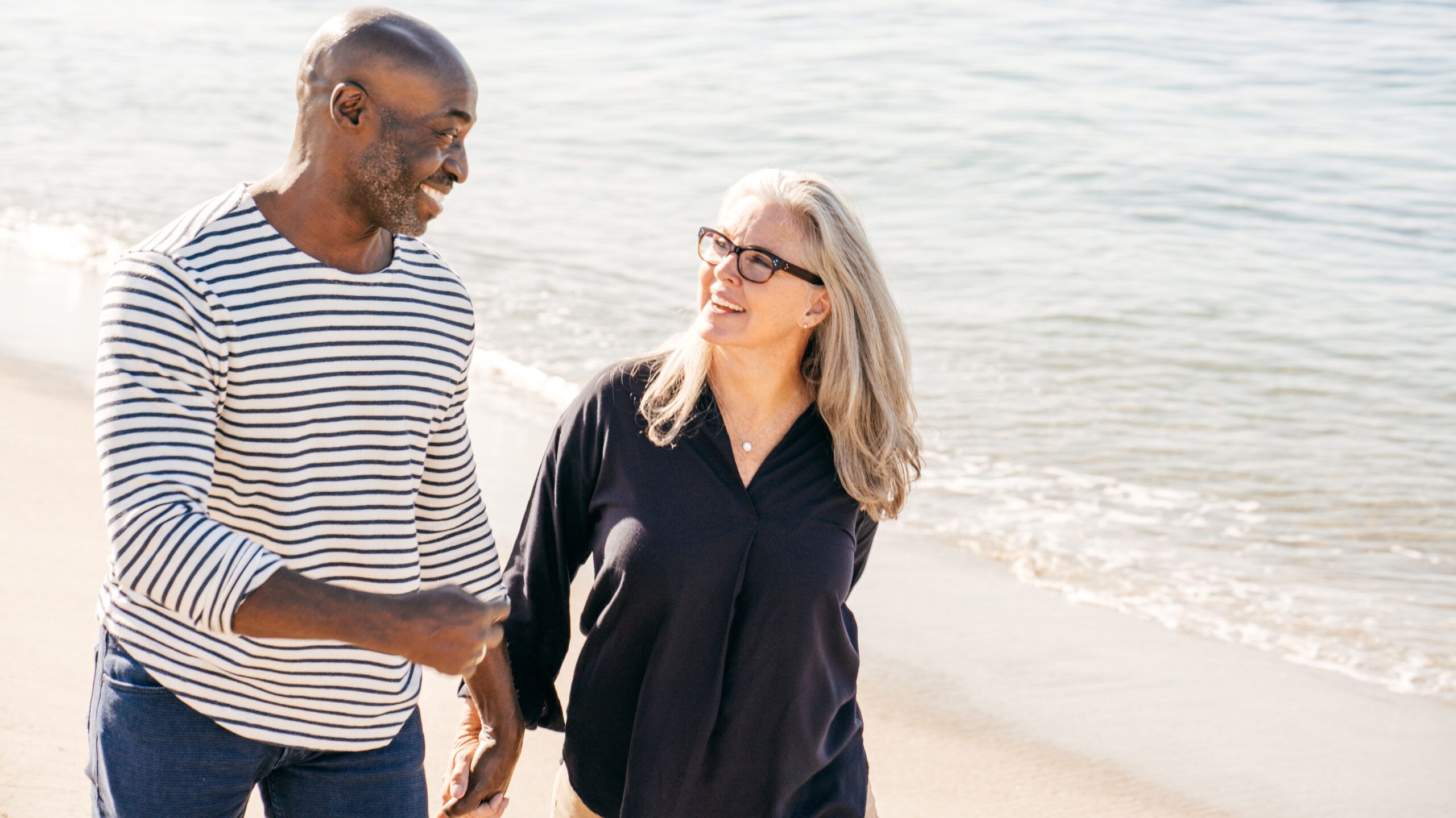 Man and woman walking on the beach