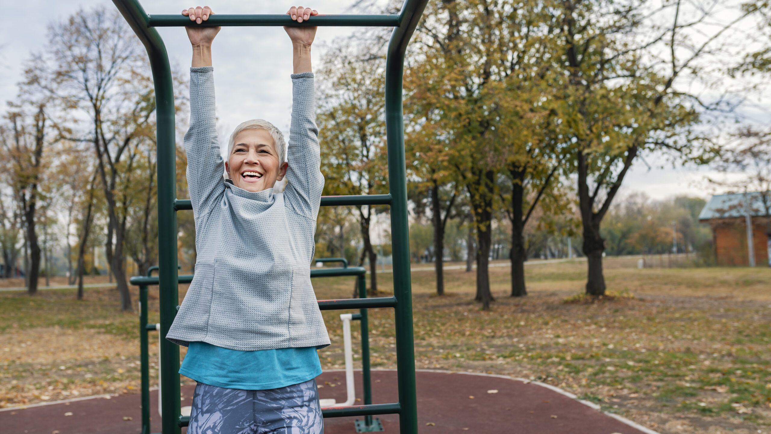 Woman on monkey bars