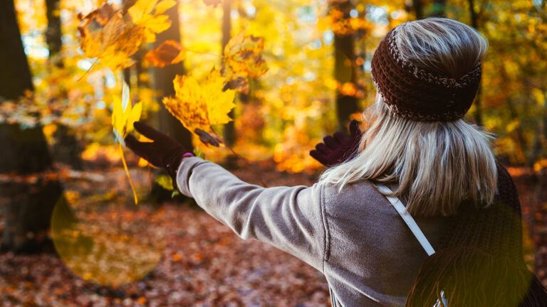 A woman enjoys the fall foliage