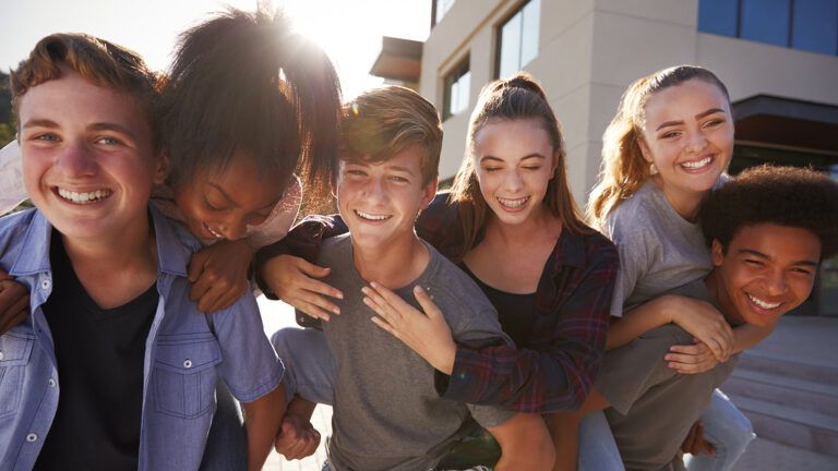 Teens laughing while discussing the importance of Lent