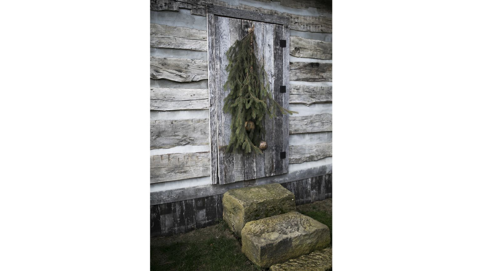 Ginny Curry's old fashioned log cabin decorated for Christmas in Lancaster, OH on January 8, 2018. Curry's husband Bill began to build the cabin and then fell ill and passed away. With the help of friends, they completed the authentic log cabin.