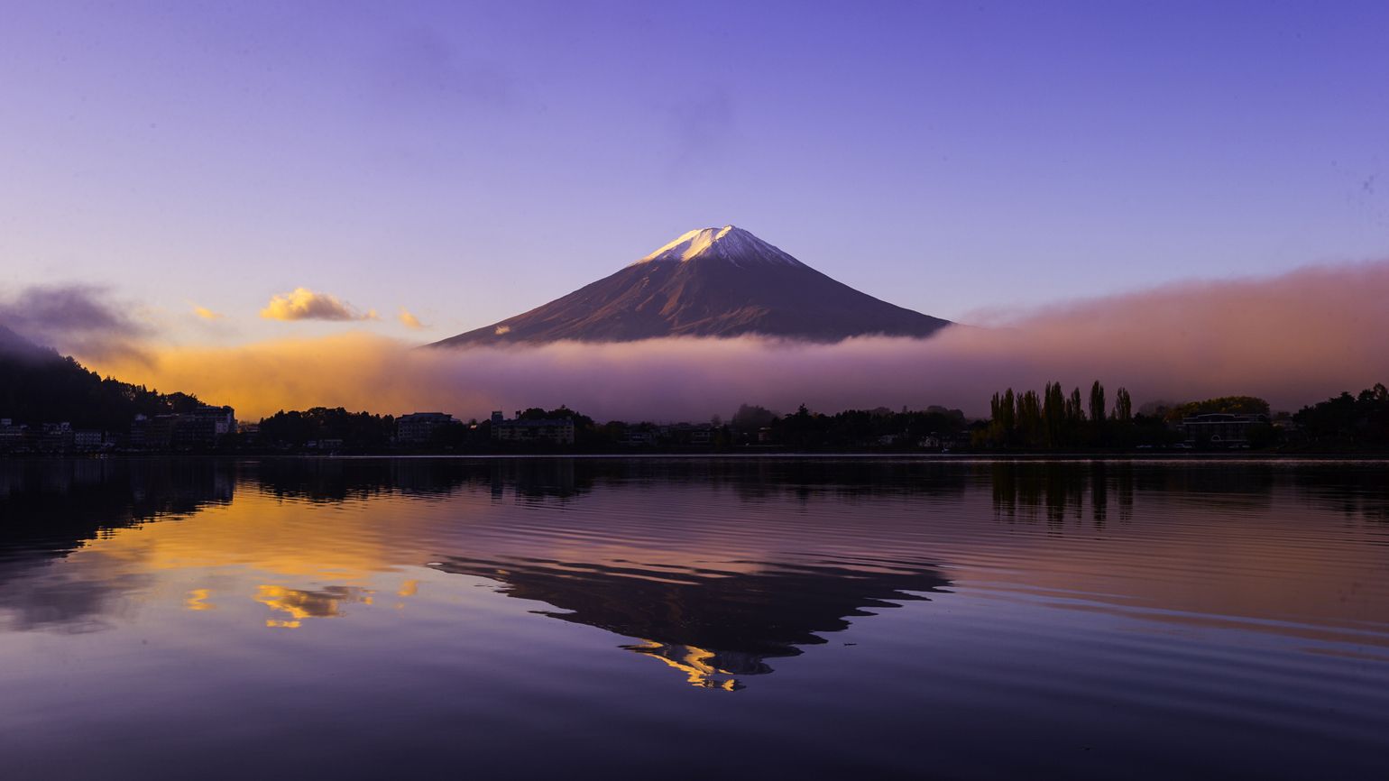 A mountain being reflected onto a lake.