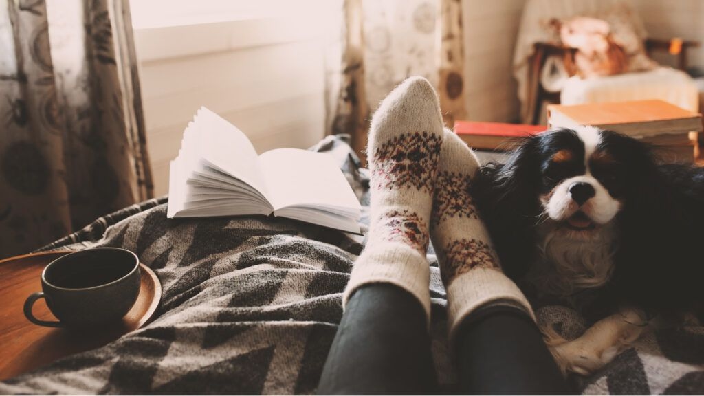 Close up of a woman wearing holidays socks relaxing.