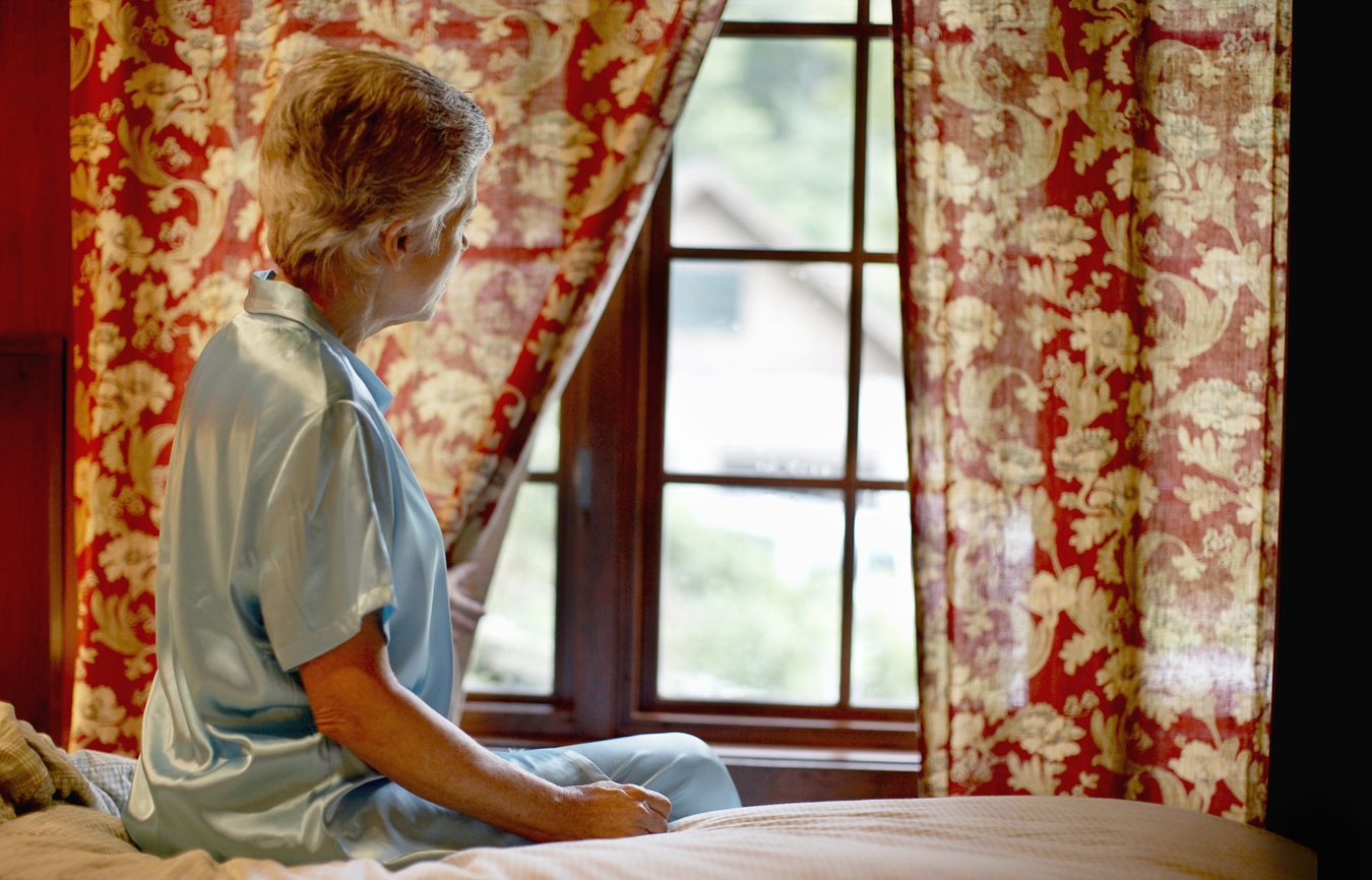 A woman looking out a window