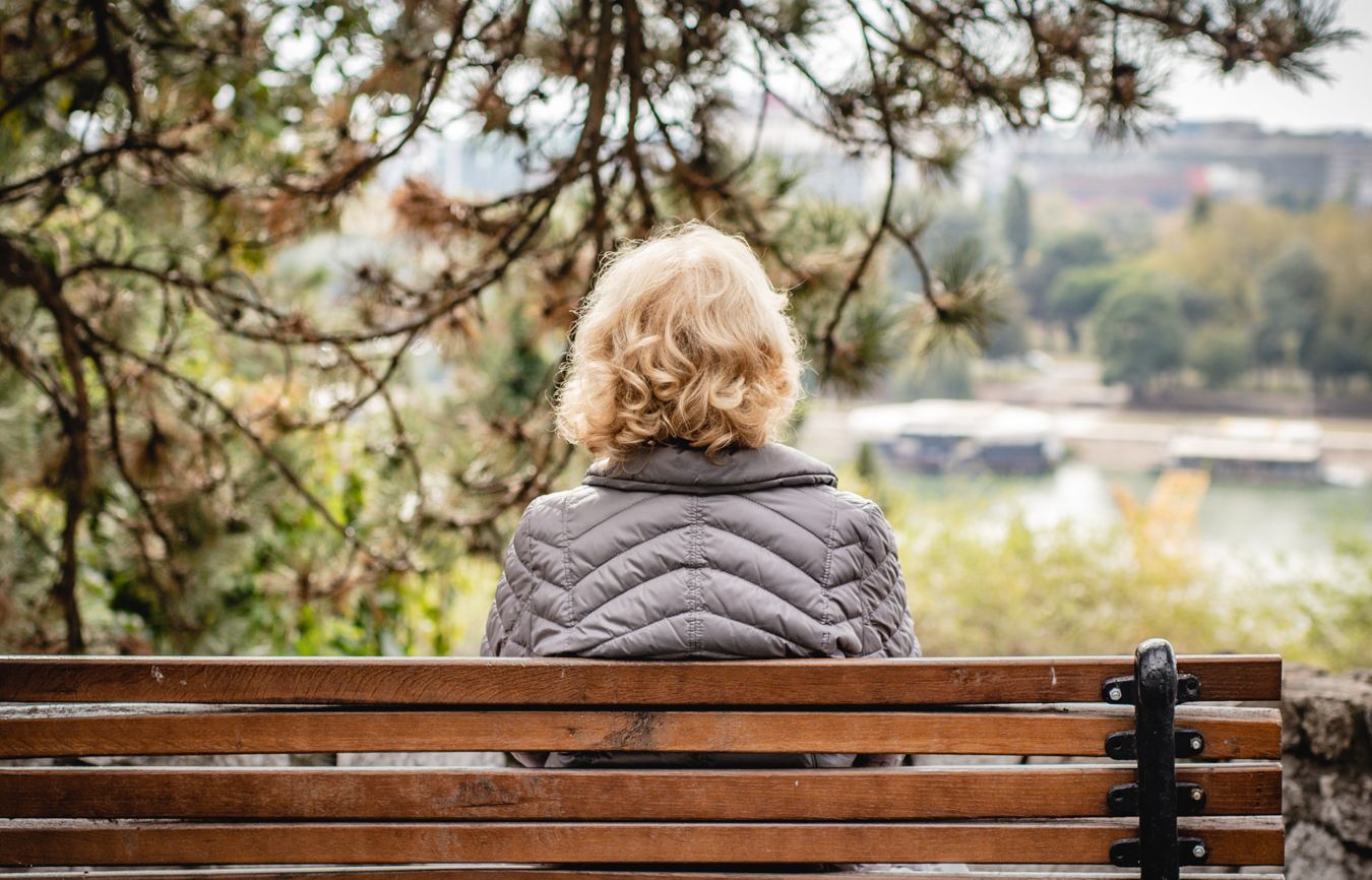 Woman sitting on a park bench