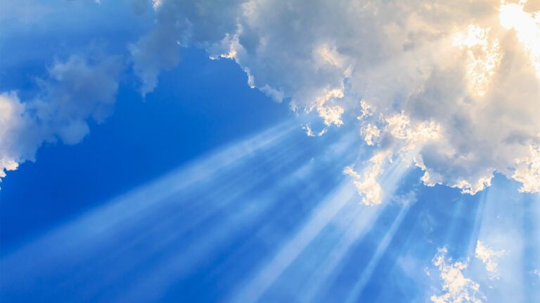 Puffy clouds reflecting a silver lining