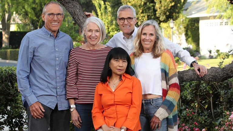 Rick and three of his siblings pose with Nora (in orange)