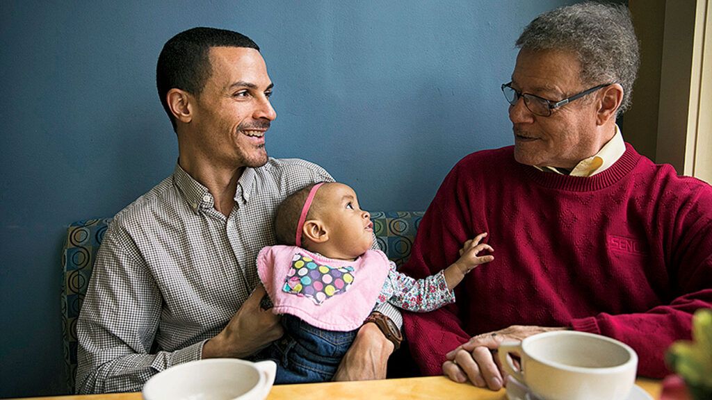 Nyon and his daughter with his father Bryant; photograph by Maddie McGarvey