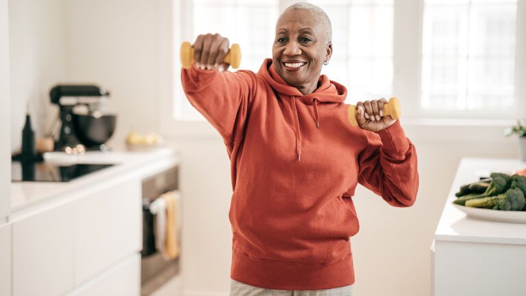 Woman exercising in her kitchen