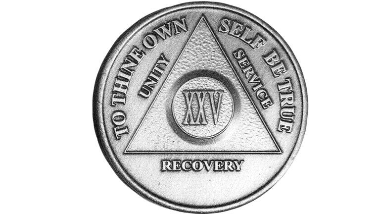 A silver AA medallion.