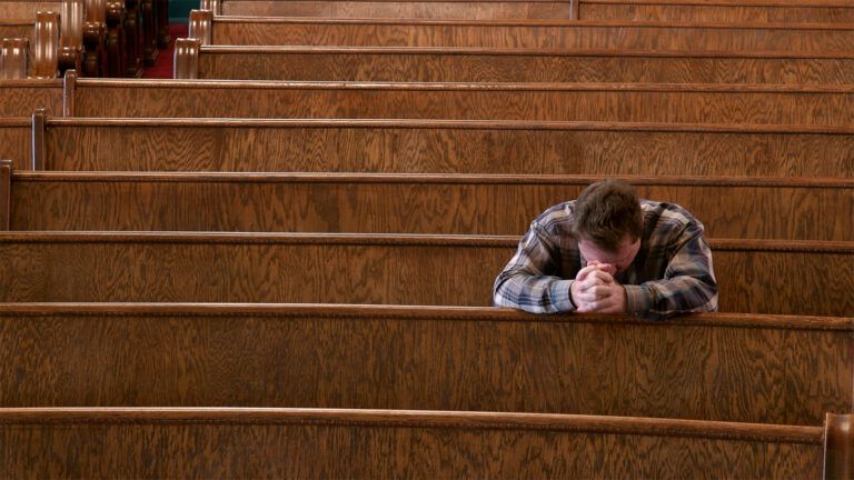 Man praying in church