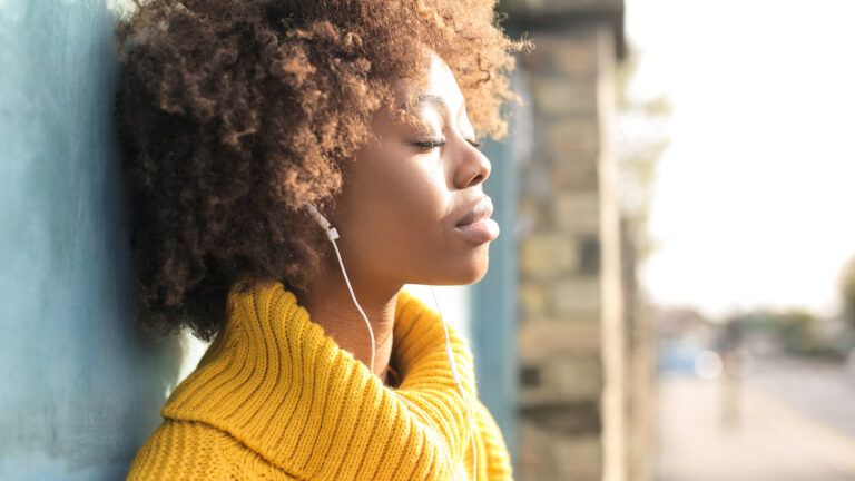 A woman listening to lent hymns