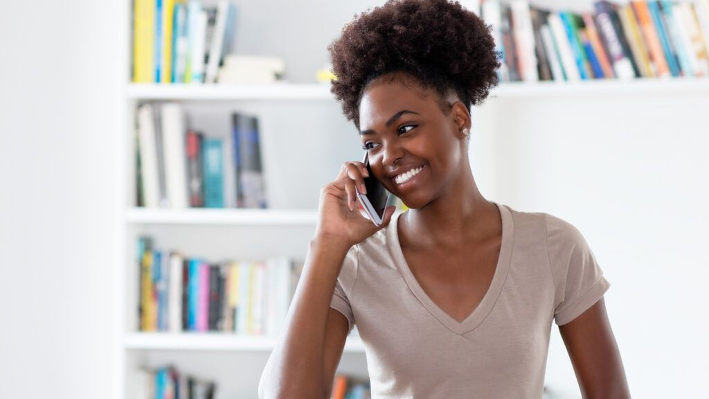 A woman on a phone call; Getty Images