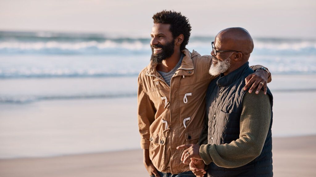 An adult son with his aging parent; Getty Images