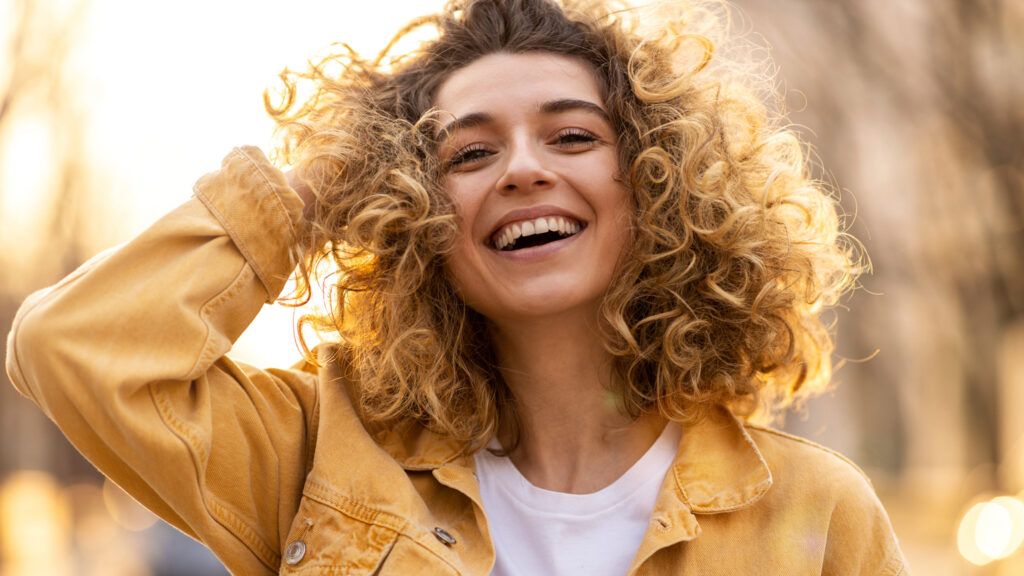 A woman laughing; Getty Images