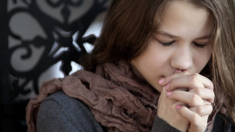 Young woman praying