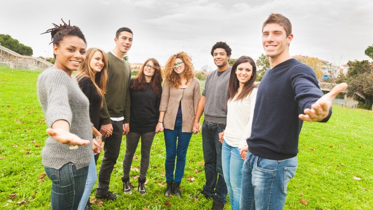 Young group holding hands