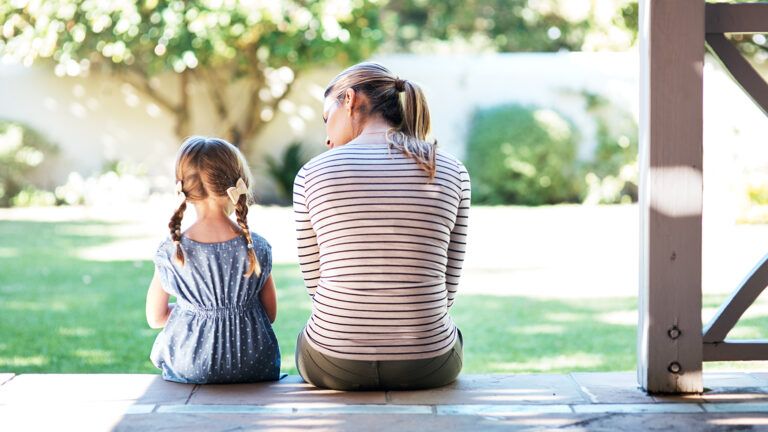 Mother and daughter on porch