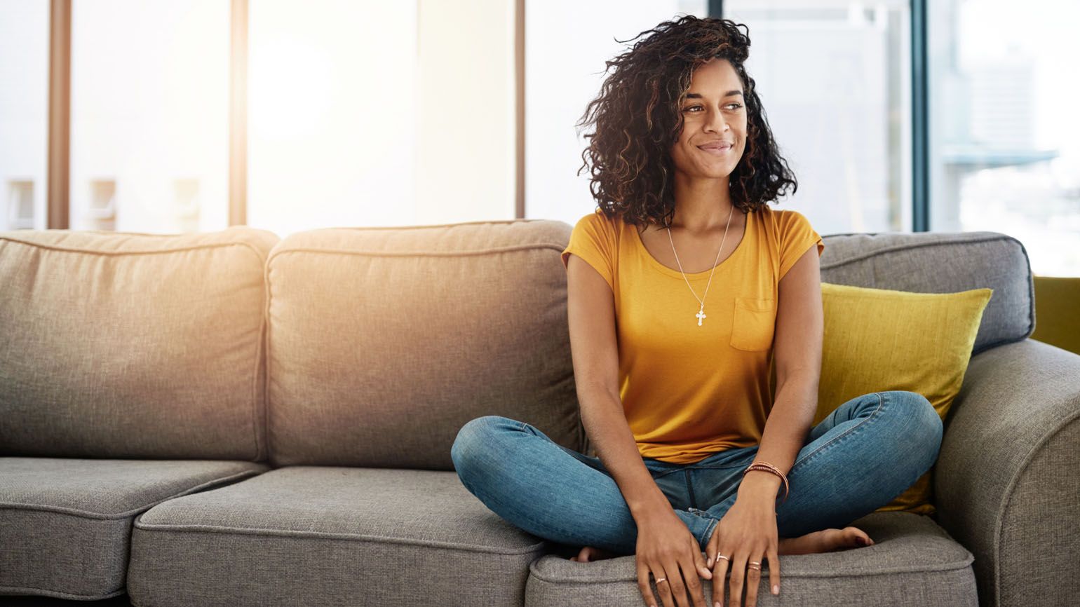 A woman sitting and thinking; Getty Images