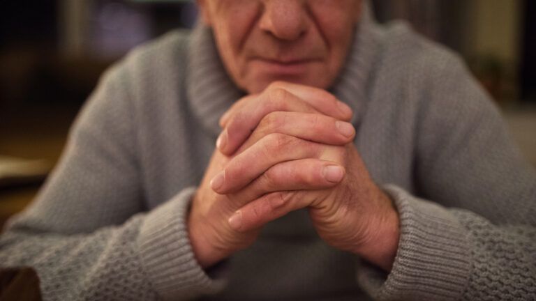 Senior man praying