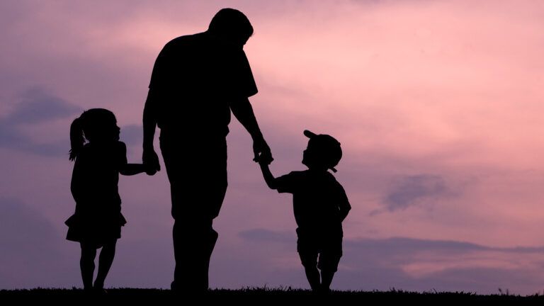 Father walking with his children