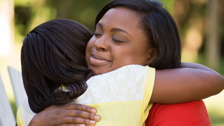 Mother and daughter hugging