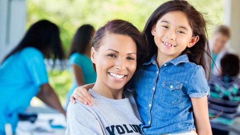 A mother and daughter serve as charity volunteers