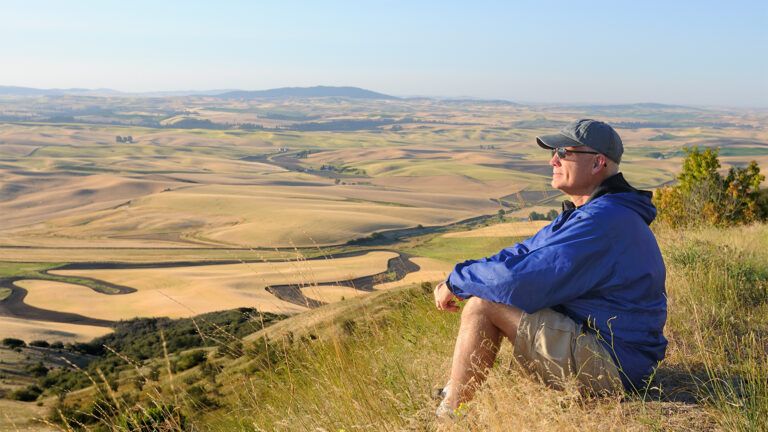 A hiker rests in a scenic spot