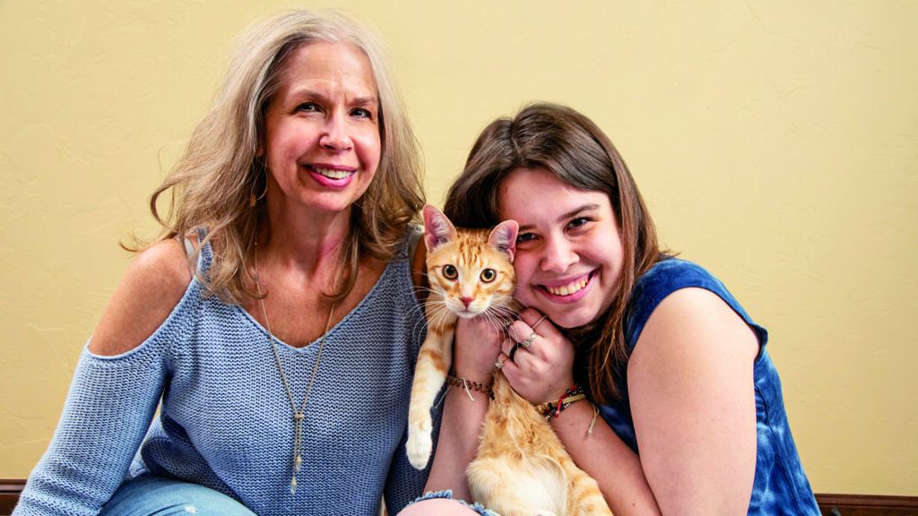 Micah Thompson and her cat, Ron, and mother Stephanie