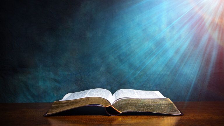 A open Bible illuminated by light from above