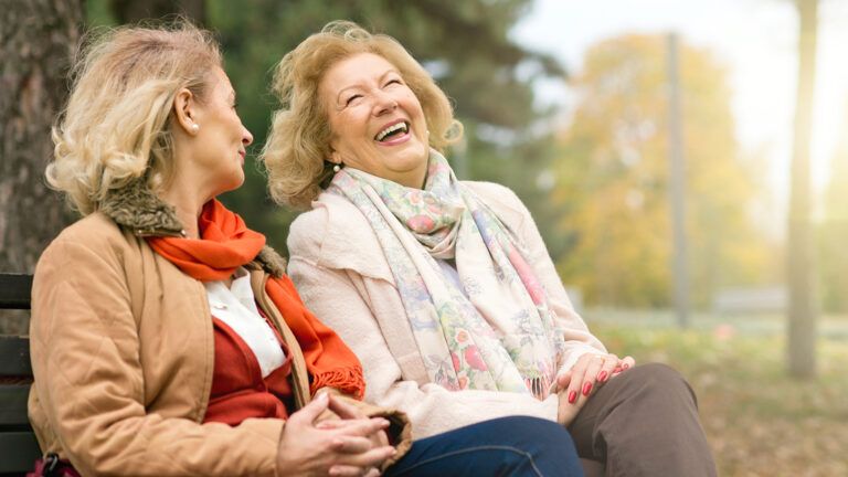 Two female friends laughing