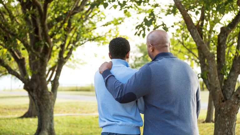 Man encouraging a younger man