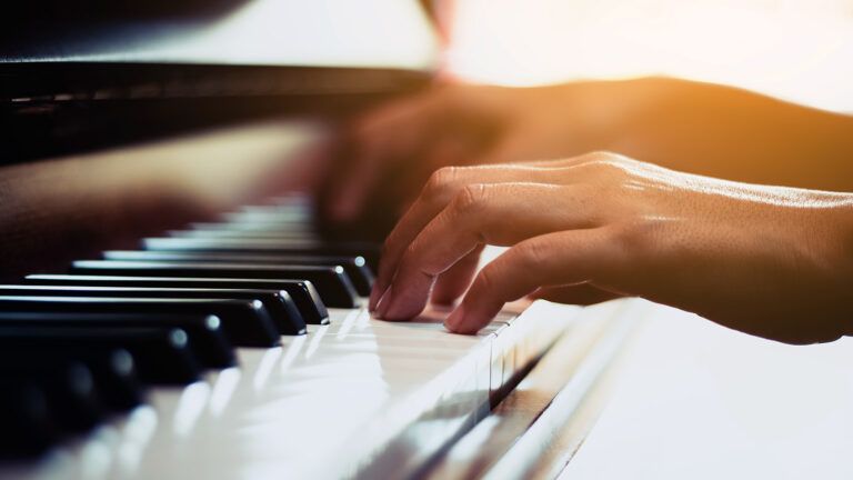 A pair of hands playing the piano