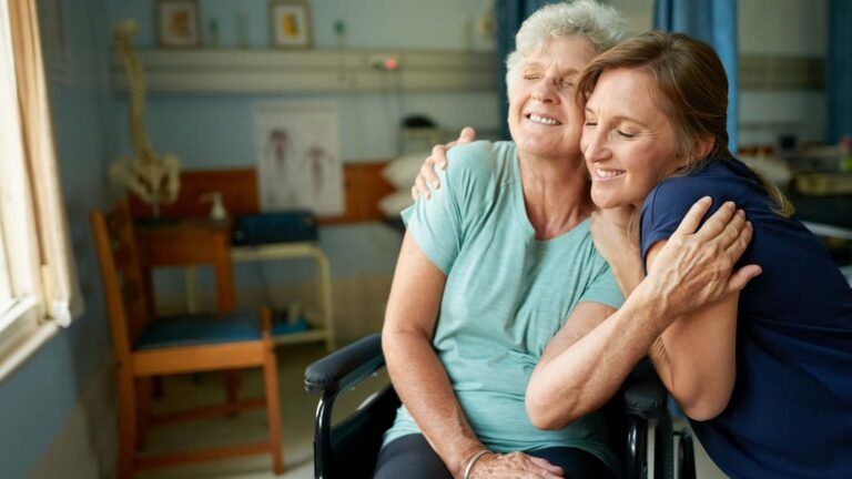 Mother and caregiver daughter in the hospital; Getty Images