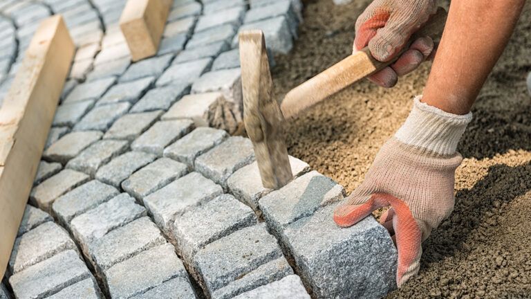 Person laying bricks out