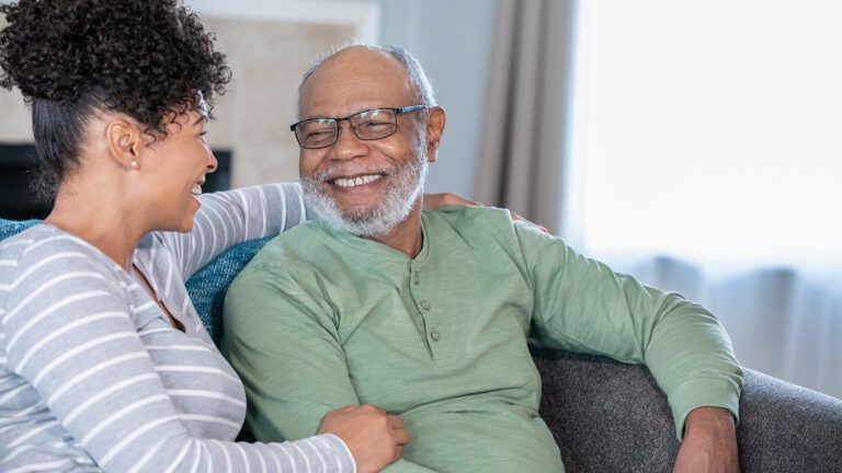 Adult daughter and senior father