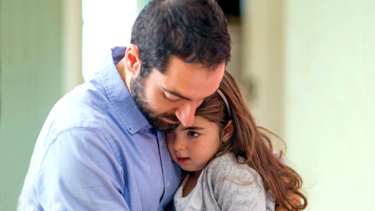 Father hugging his daughter