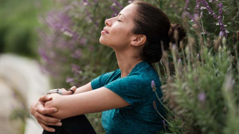 Woman with closed eyes in nature; Getty Images