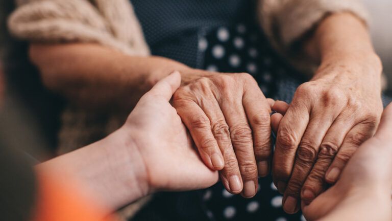 Women holding hands