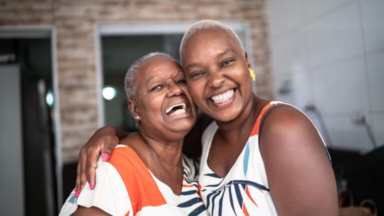 Mother and daughter smiling