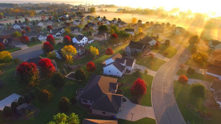 The sun rises over a small town