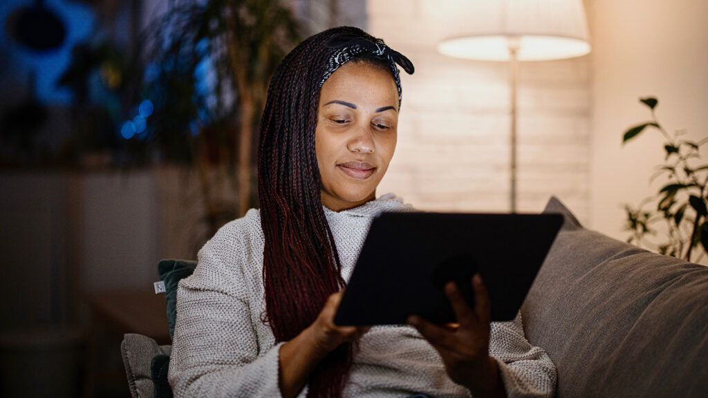 Woman using a tablet at home