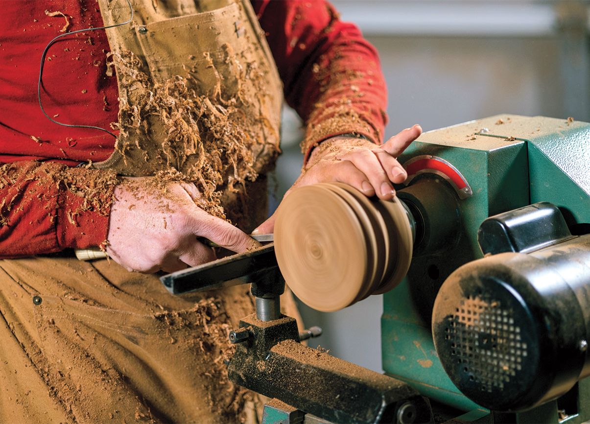 John's hands working a lathe; photo by Randy Boverman