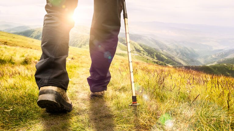 A man hikes in the countryside