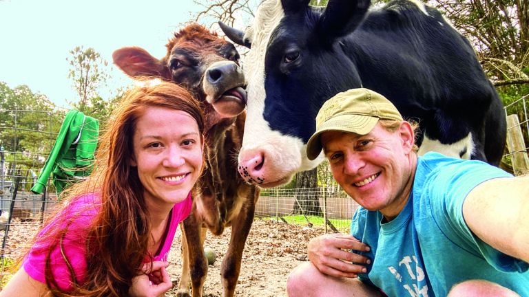 Ryan Phillips and his wife Mallory with cows, Annie and Jenna