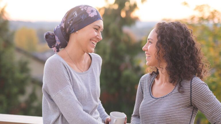 Two female friends smiling