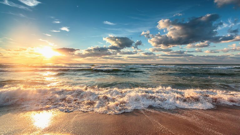 a beach at sunrise